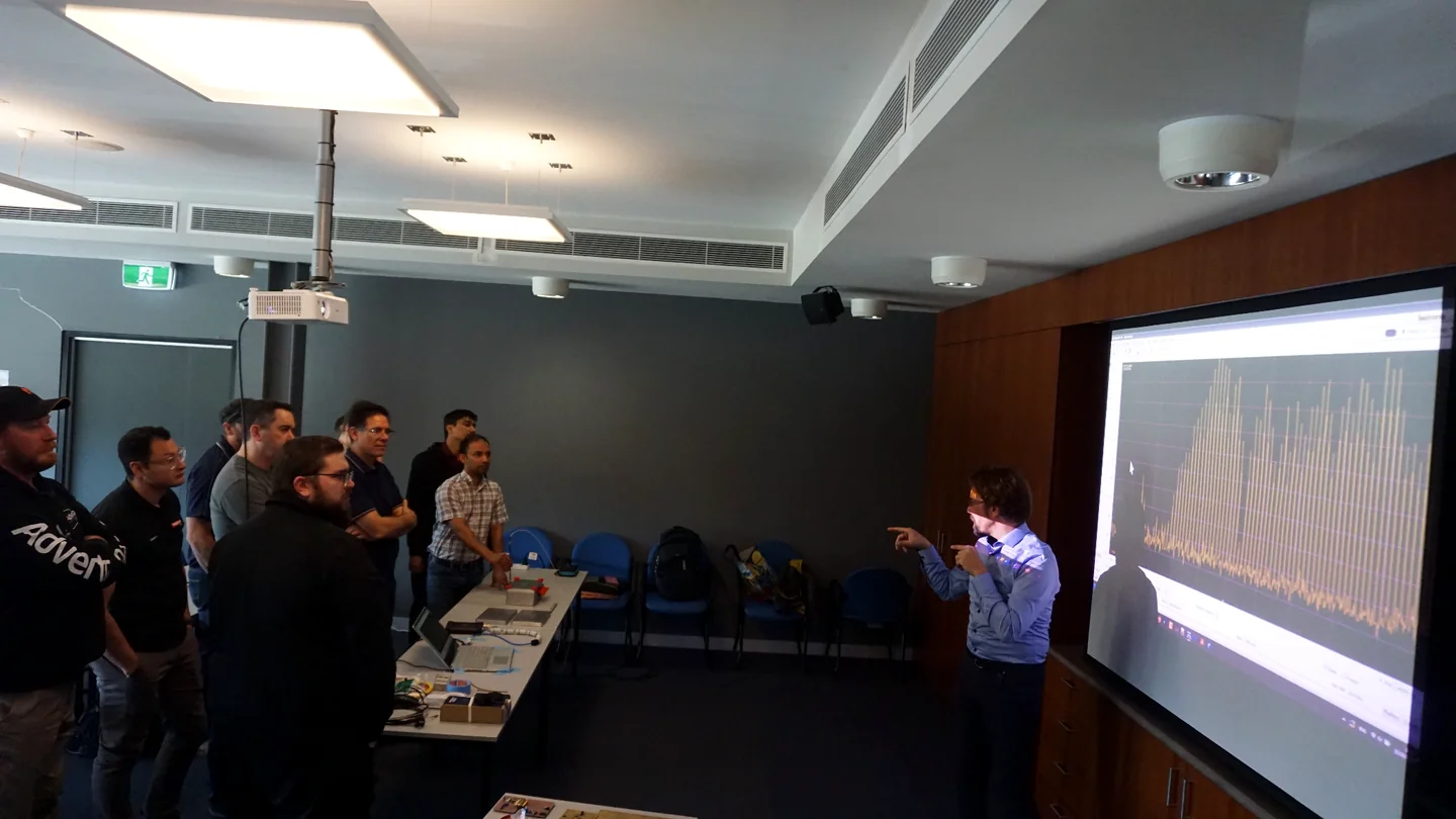Andy discussing an EMC measurement with engineers
